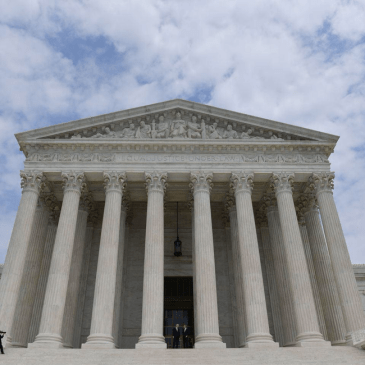 color photo of the United States Supreme Court, looking up at the Court
