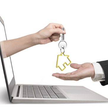 image of laptop cimputer with an arm reaching out and handing keys to a house to an extended open hand